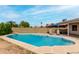 In-ground swimming pool with diving board and lounge chairs at 6416 S 19Th Pl, Phoenix, AZ 85042