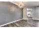 Charming dining room featuring a modern chandelier and neutral wall colors at 8712 W Sequoia Dr, Peoria, AZ 85382