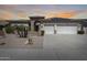 Charming single-story home with a three-car garage, solar panels, and a desert-style front yard at 8712 W Sequoia Dr, Peoria, AZ 85382