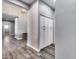 Hallway with plank flooring and neutral grey walls with built in cabinets at 8712 W Sequoia Dr, Peoria, AZ 85382