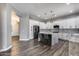Open concept kitchen featuring stainless steel appliances, a center island, and ample cabinet space at 8712 W Sequoia Dr, Peoria, AZ 85382