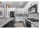 Kitchen with center island, stainless steel appliances, and marble backsplash at 8712 W Sequoia Dr, Peoria, AZ 85382