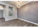 Elegant living room featuring a modern chandelier and neutral wall colors at 8712 W Sequoia Dr, Peoria, AZ 85382