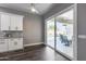 Bright, airy living room featuring sliding glass doors that open to the patio and pool at 8712 W Sequoia Dr, Peoria, AZ 85382