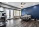 A beautifully decorated main bedroom with French doors to the back yard at 8712 W Sequoia Dr, Peoria, AZ 85382