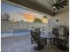 Relaxing covered patio area with outdoor seating overlooking a beautiful pool at 8712 W Sequoia Dr, Peoria, AZ 85382