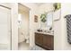 This bathroom features a plant in the window, a toilet and a tiled shower with glass door at 9333 E University Dr # 194, Mesa, AZ 85207