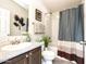 Well-lit bathroom with granite countertop vanity and a shower-tub combination at 9333 E University Dr # 194, Mesa, AZ 85207