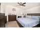 Relaxing main bedroom with soft blue bedding and dark wood furniture at 9333 E University Dr # 194, Mesa, AZ 85207