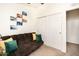 Bedroom with futon and decorative wall art, plus a large window for natural light at 9333 E University Dr # 194, Mesa, AZ 85207