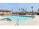Take a dip in this sparkling community pool with lounge areas and palm tree views at 9333 E University Dr # 194, Mesa, AZ 85207