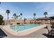 Relax poolside in this refreshing community pool surrounded by comfortable seating and beautiful landscaping at 9333 E University Dr # 194, Mesa, AZ 85207