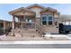 Inviting single-story home features a quaint front porch and neutral colored exterior at 9333 E University Dr # 194, Mesa, AZ 85207