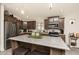 Updated kitchen features stainless steel appliances and a center island with bar seating at 9333 E University Dr # 194, Mesa, AZ 85207