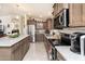 Modern kitchen with stainless steel appliances and ample countertop space at 9333 E University Dr # 194, Mesa, AZ 85207