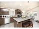 Beautiful kitchen with stainless steel appliances, center island, and modern lighting at 9333 E University Dr # 194, Mesa, AZ 85207