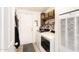 Functional laundry room with modern washer and dryer, plus practical storage solutions at 9333 E University Dr # 194, Mesa, AZ 85207
