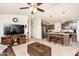 Inviting living room flows into a kitchen island with granite countertops and stainless appliances at 9333 E University Dr # 194, Mesa, AZ 85207