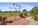 Landscaped backyard featuring lush green grass and golf course views at 9717 W Marco Polo Rd, Peoria, AZ 85382