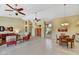 Expansive living space featuring a combined dining and living area, complete with stylish furnishings and neutral decor at 9717 W Marco Polo Rd, Peoria, AZ 85382