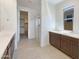 Bright Primary bath includes dual vanities, glass enclosed shower, and natural light from a window at 9845 E Tahoe Ave, Mesa, AZ 85212