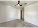 Bedroom featuring neutral carpet, ceiling fan, and a walk-in closet at 9845 E Tahoe Ave, Mesa, AZ 85212