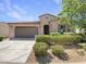 Charming single-story home with a well-manicured front yard and a two-car garage at 9845 E Tahoe Ave, Mesa, AZ 85212