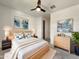 Serene main bedroom with modern decor, fan, and natural light at 9845 E Tahoe Ave, Mesa, AZ 85212