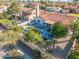 Aerial view of a backyard featuring a pool, patio area, mature trees, and privacy wall at 10248 E San Salvador Dr, Scottsdale, AZ 85258