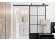 En suite bathroom with modern vanity, lighted mirror and sliding glass door at 10248 E San Salvador Dr, Scottsdale, AZ 85258