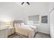 Cozy bedroom featuring neutral tones, a comfortable queen-sized bed, and ample natural light at 10248 E San Salvador Dr, Scottsdale, AZ 85258