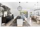 Elegant dining room featuring a modern chandelier, dark wood table, and access to the patio at 10248 E San Salvador Dr, Scottsdale, AZ 85258