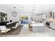 Open-concept kitchen and dining area with modern lighting, a large island, and sliding glass doors at 10248 E San Salvador Dr, Scottsdale, AZ 85258
