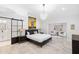 Spacious main bedroom with a luxurious en-suite bathroom and stylish chandelier at 10248 E San Salvador Dr, Scottsdale, AZ 85258