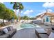 Relaxing backyard pool area with comfortable patio furniture and an outdoor fire pit at 10248 E San Salvador Dr, Scottsdale, AZ 85258