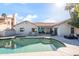 Beautiful backyard pool with patio furniture and a well-maintained red tiled roof house at 10248 E San Salvador Dr, Scottsdale, AZ 85258