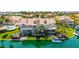 Beautiful waterfront home with lush landscaping, private dock, and covered balconies at 10390 E Lakeview Dr # 204, Scottsdale, AZ 85258