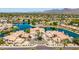 Stunning aerial view of waterfront homes boasting well-manicured landscaping and a beautiful lake at 10390 E Lakeview Dr # 204, Scottsdale, AZ 85258