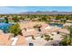 Wide aerial shot reveals a luxury home with a private driveway and terra cotta roof at 10390 E Lakeview Dr # 204, Scottsdale, AZ 85258