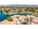 Expansive aerial view showcases the lakefront properties with terra cotta roofs at 10390 E Lakeview Dr # 204, Scottsdale, AZ 85258