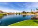 Tranquil backyard with water views, lush lawn, and serene landscaping at 10390 E Lakeview Dr # 204, Scottsdale, AZ 85258