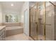 Bathroom showcasing shower stall with glass door and a bathtub at 10390 E Lakeview Dr # 204, Scottsdale, AZ 85258