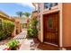 Elegant front door with meticulously landscaped front yard and walkway at 10390 E Lakeview Dr # 204, Scottsdale, AZ 85258
