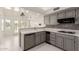 Bright kitchen with tile floors, tile backsplash, and stainless steel appliances at 10390 E Lakeview Dr # 204, Scottsdale, AZ 85258