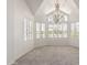 Bright living room with high ceilings, and ample natural light from large bay windows with shutters at 10390 E Lakeview Dr # 204, Scottsdale, AZ 85258