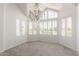 Bright living room with high ceilings, and ample natural light from large bay windows with shutters at 10390 E Lakeview Dr # 204, Scottsdale, AZ 85258