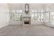 Spacious living room featuring a fireplace and large windows for natural light at 10390 E Lakeview Dr # 204, Scottsdale, AZ 85258