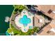 Aerial shot of swimming pool complete with hot tub, lounge chairs, and lush landscape at 10390 E Lakeview Dr # 204, Scottsdale, AZ 85258
