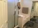 Modern bathroom with glass shower, separate soaking tub, and closet at 10489 S 182Nd Dr, Goodyear, AZ 85338