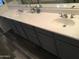 Bathroom featuring a double sink vanity with ample counter space at 10489 S 182Nd Dr, Goodyear, AZ 85338